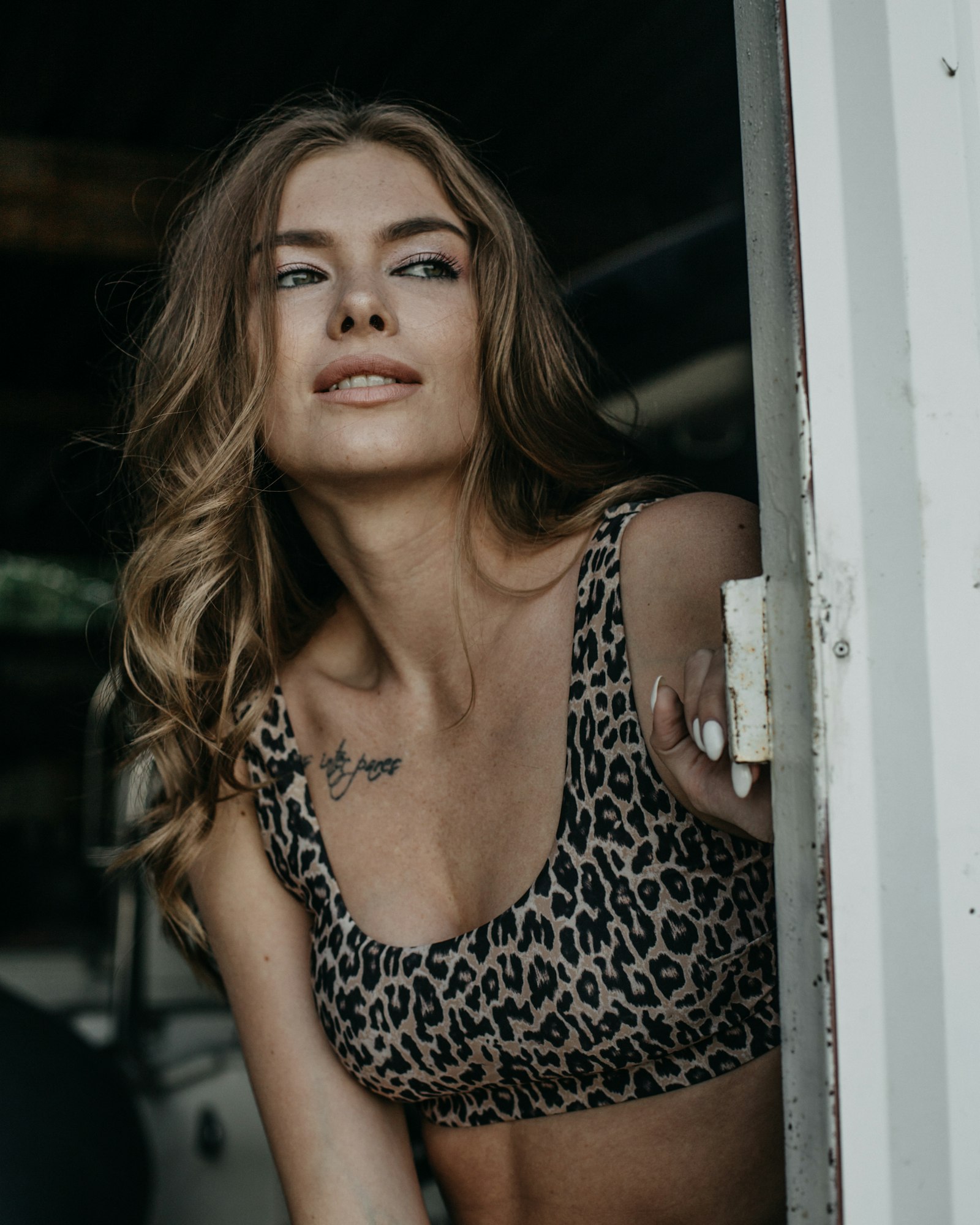 A woman in a leopard print bikini top